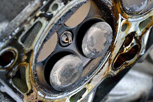 Causes for carbon buildup on valves