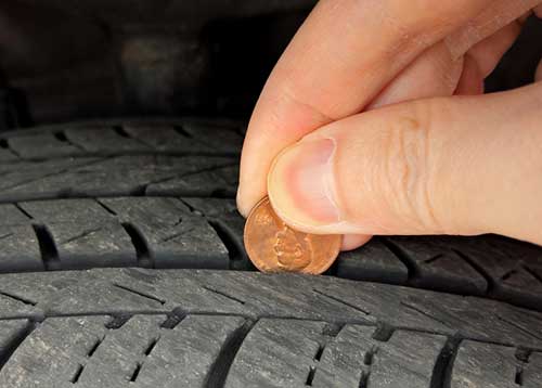 checking tire tread depth wear with a penny tire safety and maintenance