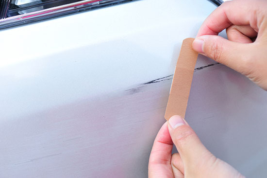remove scratches from plastic on a car exterior